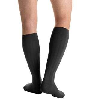
Close-up side view of a person
wearing JOBST for men Explore Knee High Closed Toe Dark Grey