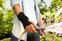 Close up of men wearing an Actimove Professional Line Manus Forte Wrist Brace while gardening
