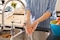 Close up of woman wearing Actimove Professional Line Rhizo Forte Thumb Orthosis, washing her hands