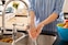 Close up of woman wearing Actimove Professional Line Rhizo Forte Thumb Orthosis, washing her hands
