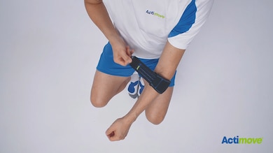 How to put on Actimove Sports Edition Elbow Strap with Hot/Cold Pack: slide your arm through the the strap and fasten the strap
How to put on Actimove Sports Edition Elbow Strap with Hot/Cold Pack: slide your arm through the the strap and fasten the strap