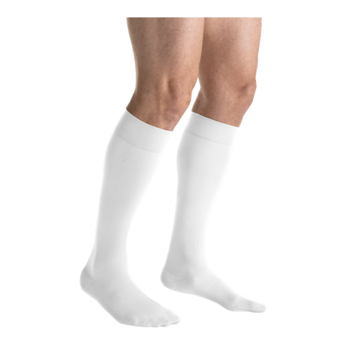 Close-up side view of two legs in JOBST forMen white knee-high compression socks.