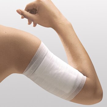 Fixation of dressing with Easifix by Leukoplast on arm