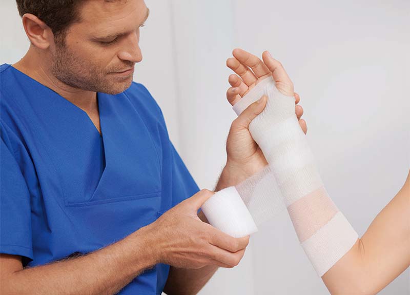 Close-up of a person's arm wearing a cast tape 