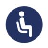 A blue circle icon featuring a white silhouette of a person sitting in a chair.