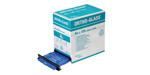 A woman wearing an arm cast preparing food in a kitchen.