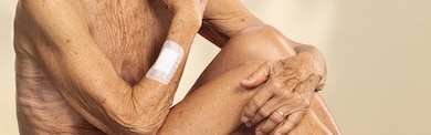 Image showing a close up of an elderly person with a Leukoplast skin sensitive dressing 