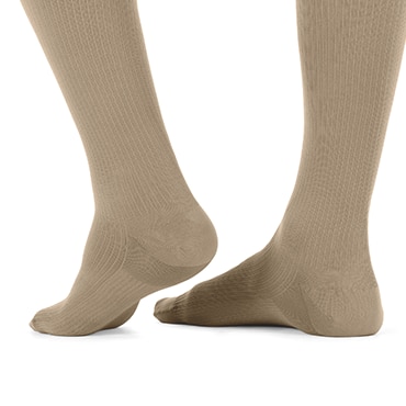 The specially constructed sole for cushioning in a pair of beige JOBST forMen socks