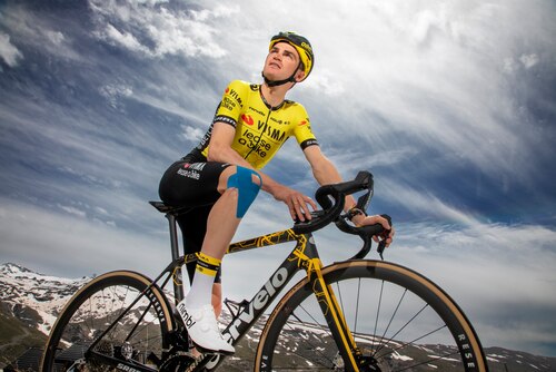 Sepp Kuss from Visma Lease a Bike cycling team wearing blue Leukotape K by Actimove kinesiology tape