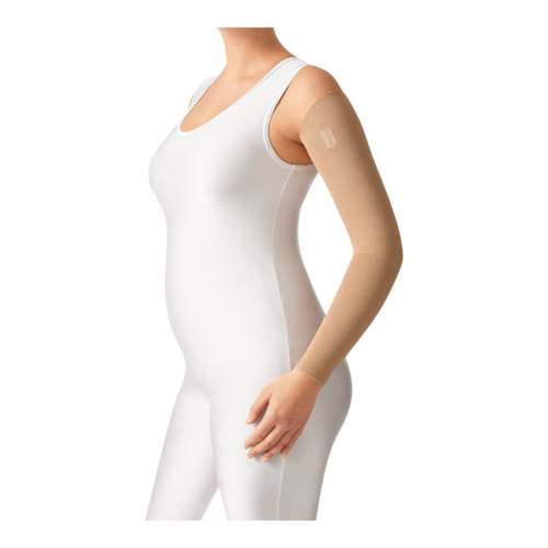 Female wearing a white body suit and a JOBST Confidence beige arm sleeve garment. 