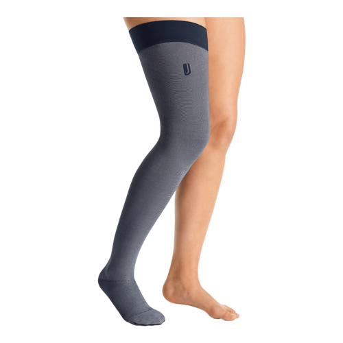 Right leg wearing a JOBST Confidence thigh-high closed toe grey leg compression garment.