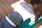 Back close-up of man at gym doing planks, wearing an Actimove Sports Edition Back Support with 4 Stays
