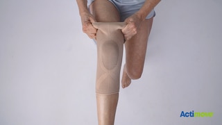How to put on the Actimove Everyday Supports Knee Support with Closed Patella: pull the knee support up your leg
