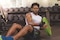 Man wearing Actimove Sports Edition Thumb Stabilizer while lifting weights at the gym

