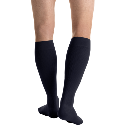 Close-up side view of a person 
wearing JOBST for men ambition Knee High Closed Toe Navy