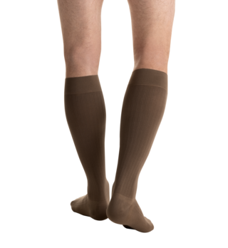 Close-up side view of a person 
wearing JOBST for men ambition Knee High Closed Toe Brown