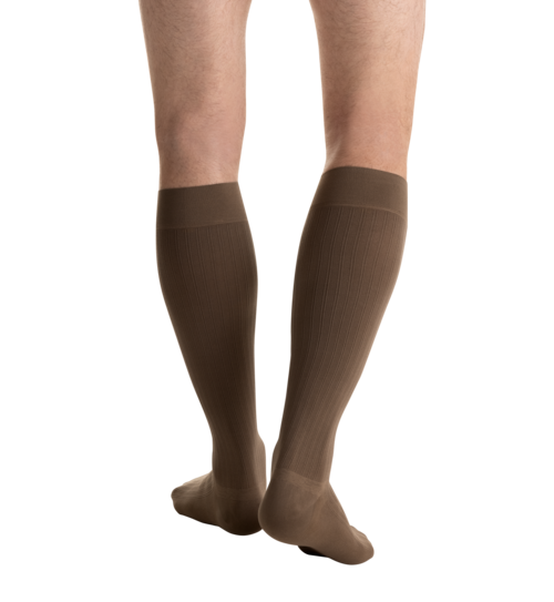 Close-up side view of a person 
wearing JOBST for men ambition Knee High Closed Toe Brown