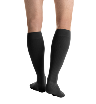 Close-up side view of a person 
wearing JOBST for men ambition Knee High Closed Toe Dark Grey