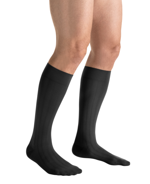 Close-up side view of a person 
wearing JOBST for men ambition Knee High Closed Toe Dark Grey