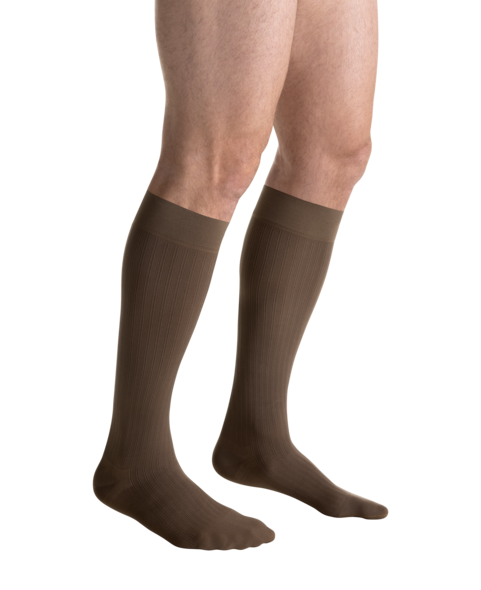 Close-up side view of a person 
wearing JOBST for men ambition Knee High brown