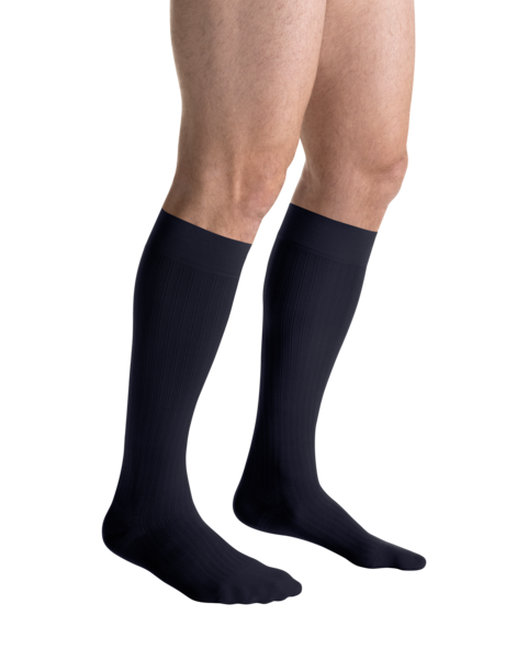 Close-up side view of a person 
wearing JOBST for men ambition Knee High Closed Toe navy