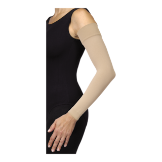 Female in a black bodysuit with her hands on her hips, wearing JOBST Bella strong arm sleeve.