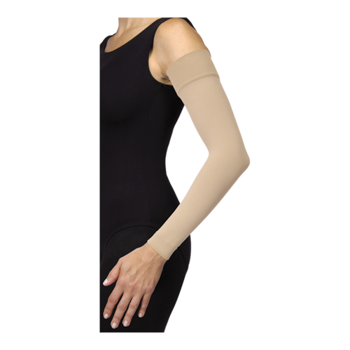 Female in a black bodysuit with her hands on her hips, wearing JOBST Bella strong arm sleeve.