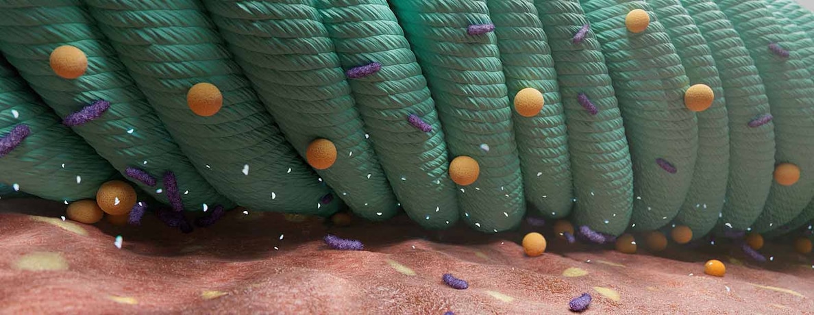 A close up of an illustration of Cutimed Sorbact green dressing against the skin