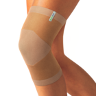 Beige knitted Actimove Arthritis Care Knee Support with heat reflecting technology on slightly bent knee 
