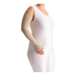 Female in a white bodysuit wearing a JOBST Bella Lite beige arm compression sleeve.