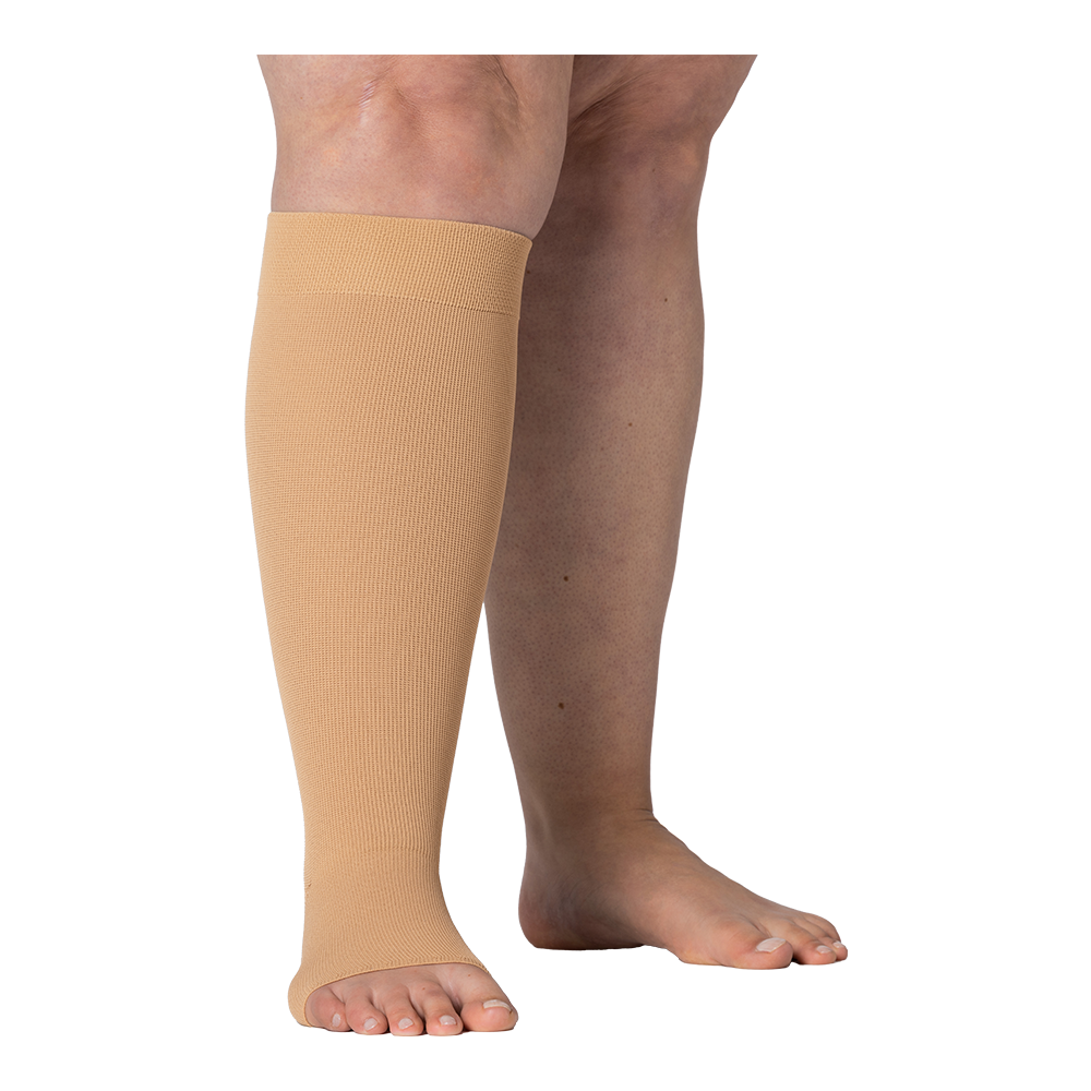 Right legs wearing JOBST Elvarex compression beige knee stockings.