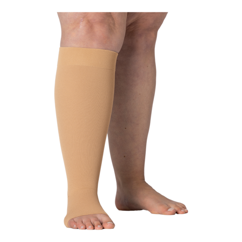 Right legs wearing JOBST Elvarex compression beige knee stockings.