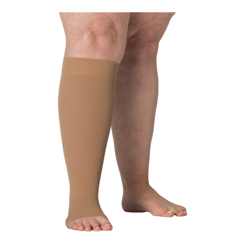 Right legs wearing JOBST Elvarex compression caramel knee stockings.